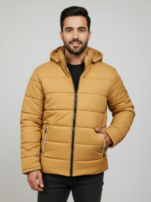 Distinct mustard color with bold, earthy appeal Classic horizontal puffer quilting for premium insulation Attached hood for added wind and rain protection Black contrast zipper with white-trimmed pull details Contemporary fit with a clean, modern silhouette Secure functional zipper pockets with unique pull tabs